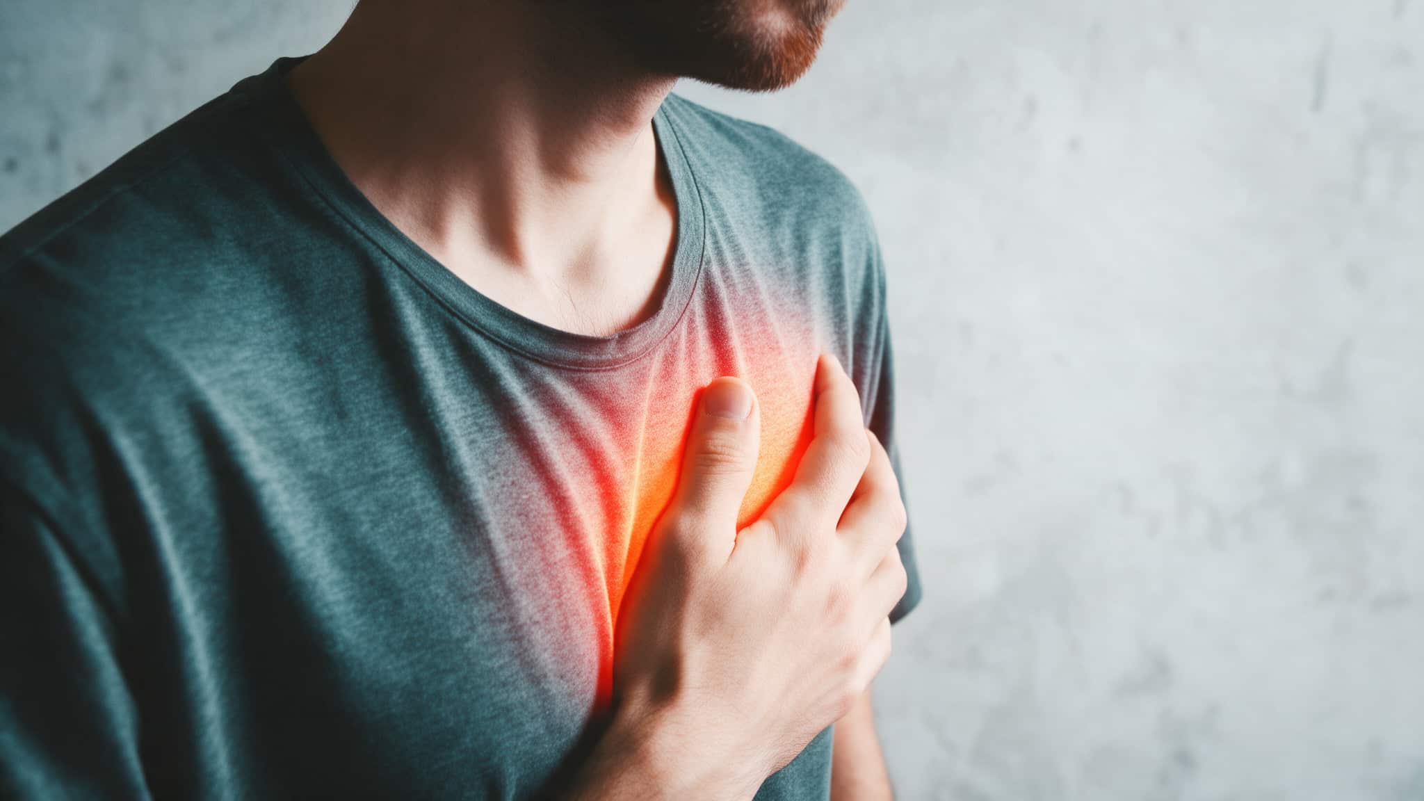 Man holding his chest in pain