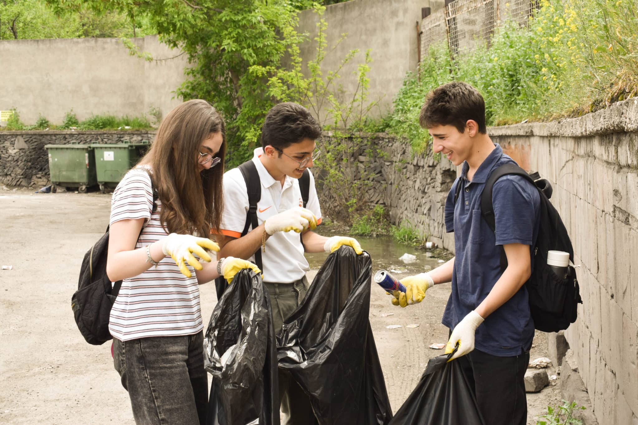 Cleanup volunteers sorting collected trash