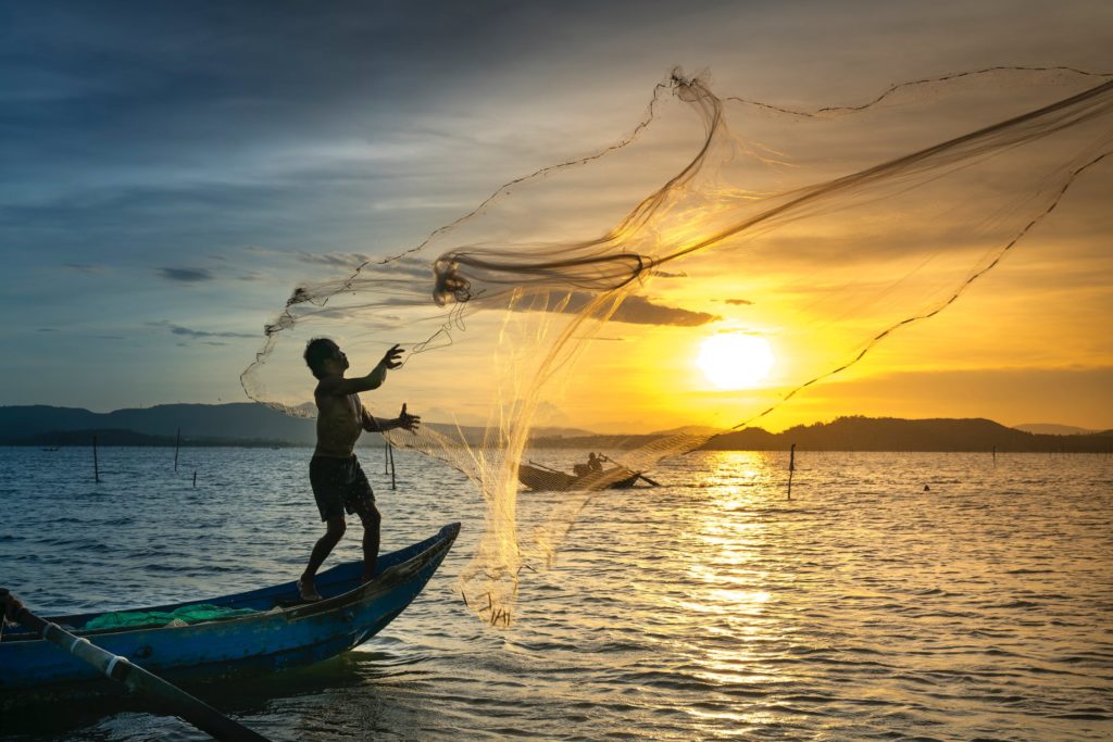 fisherman casting net